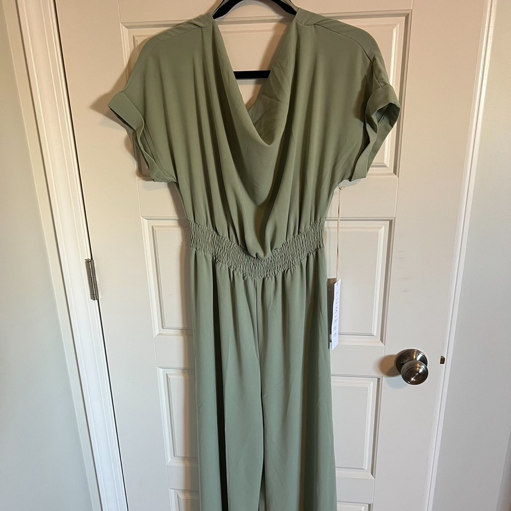 New with tag Baltic Born pant suit, tie back, wide leg in color sage.